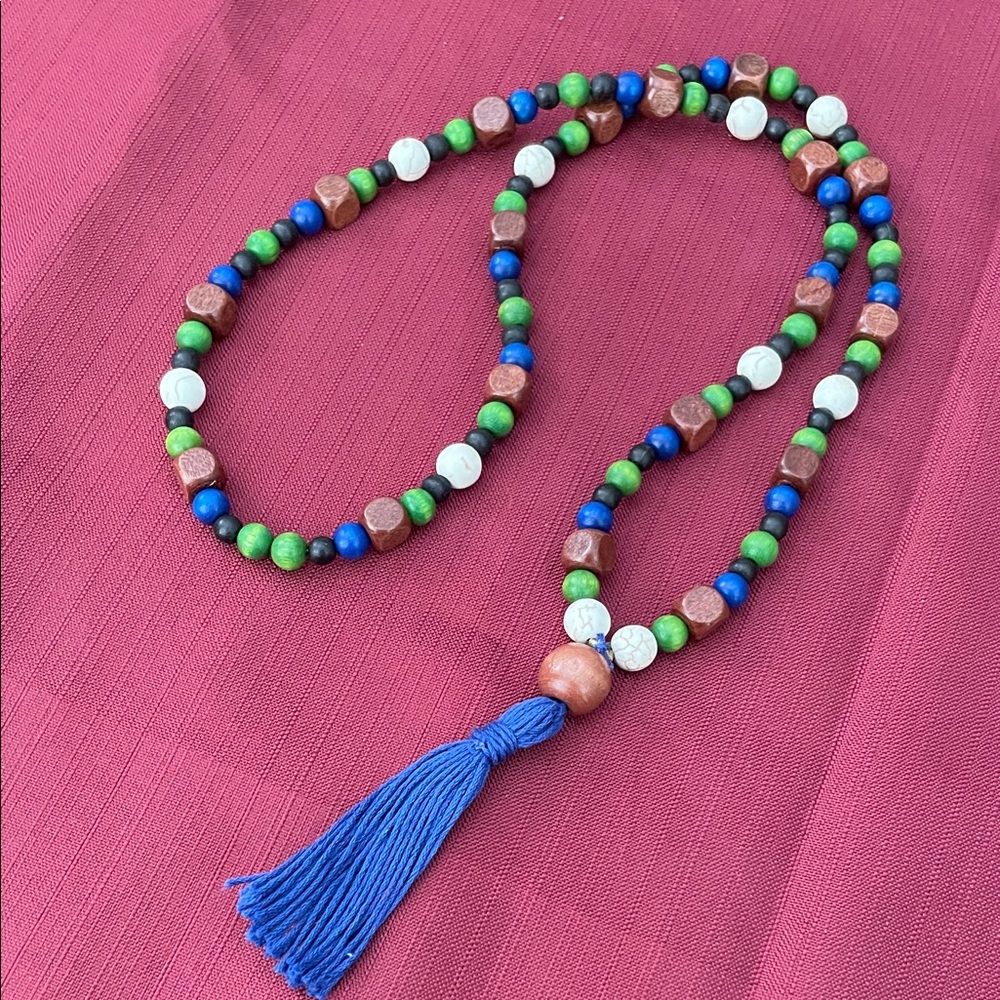 Hand assembled beaded necklace blue tassel